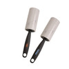 Two lint removers with grey adhesive rollers and black handles, featuring branding on one handle.