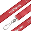 A detailed woven lanyard in red featuring a logo and a metal clip for attachment.