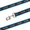 A detailed woven dog leash in black and blue with a silver clip and a logo.