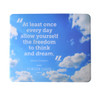 A mouse mat featuring a blue sky design with clouds and a quote attributed to Albert Einstein. It includes a logo.