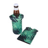 A drink bottle cooler featuring a tropical green leaf design, with a matching cooler sleeve beside it.