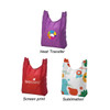 A purple tote bag with a logo, a red tote bag with branding, and a multicoloured patterned tote bag.