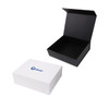 A large foldable magnetic box in white with a logo, featuring a black interior.
