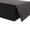 A large black foldable magnetic box with a triangular flap, featuring a smooth, matte finish and a logo.