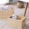 A wooden storage box set in natural colour, featuring one box filled with items like toys and snacks.