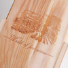 A wooden wine box featuring an engraved design and branding, showcasing natural wood colour and a smooth finish.