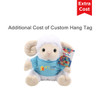 A plush sheep toy wearing a blue shirt and holding a colourful hang tag, featuring a logo.