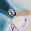 A blue PU leather pencil case featuring a smooth zipper closure and a playful design.