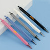 A selection of plastic pens in black, white, grey, blue, and pink featuring a logo on each barrel.