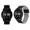 A black round smartwatch with a digital display and two interchangeable straps, one in black and one in grey.