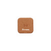 A square cork wireless charger featuring a simple design and a logo.