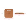 A square cork wireless charger in a light brown shade, featuring a simple logo, measuring 95mm by 15mm.