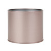A small, round, metallic tin can in a rose gold colour, without a lid. Features a simple design.