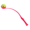 A pink ball thrower with a curved arm and a tennis ball attached at the end. It has a textured handle for grip.