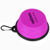 A collapsible silicone bowl in vibrant pink, featuring a black rim and a carabiner for attachment.