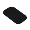 A black dashboard mat with a textured surface, featuring a smooth edge and a rounded shape.