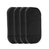 A set of four black dashboard mats with a textured surface. Each mat features a smooth border.