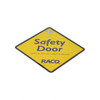 A yellow diamond-shaped warning sign with the text "Safety Door" and a logo, used for exhibitions and events.