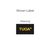 A black woven label featuring the word "TUOA" in yellow lettering.