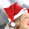 A red Santa hat with a white trim and pom-pom, featuring a logo on the side.