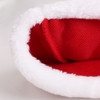 A red plush Santa hat with a fluffy white trim, showcasing its interior fabric texture.