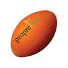 An orange stress ball in the shape of a rugby ball, featuring a logo.