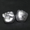 Clenched fist-shaped stress relievers in silver, featuring a logo on one side.