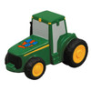 A green tractor-shaped stress reliever with yellow wheels and a logo on the side.