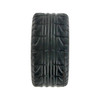 A black tire-shaped stress reliever with detailed tread pattern and a rounded design. Features a logo.