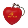 A red heart-shaped stress reliever attached to a metal keyring. It features a logo.