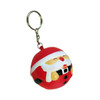 A red Santa stress reliever keyring with a smiling face, attached to a metal keychain.