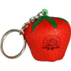 A red strawberry-shaped stress reliever keyring with a green top and a metal keyring attached.