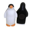A black and white penguin-shaped stress reliever with an orange beak and a magnet on the back.