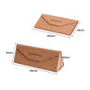 A foldable cork glasses case in natural brown, featuring an embossed logo and a triangular shape when opened.