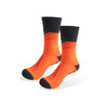 A pair of bright orange football socks with a black cuff and toe area, featuring a logo.