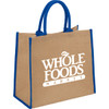 A large jute tote bag in a natural beige colour with blue handles and branding.
