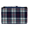 A folded picnic rug with a navy, green, and red tartan pattern, featuring a handle for carrying.