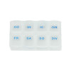 A white pill box with blue lettering, featuring compartments labelled for each day of the week and a division section.
