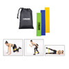 Three resistance bands in green, blue, and yellow, accompanied by a black drawstring bag featuring a logo.