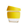 A glass coffee cup featuring a clear body with a bright yellow silicone lid and sleeve. It includes a logo.