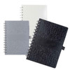 A collection of La Trobe Stone Paper Notebooks in white, grey, and black, featuring textured covers and spiral bindings.