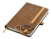 A brown bonded leather notebook with an elastic band and ribbon bookmark, featuring a textured cover and a logo.