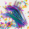 A group of multicoloured stainless steel straws with a shiny finish, surrounded by colourful confetti.