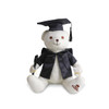 A plush white bear wearing a graduation gown and cap, holding a pen, featuring a logo on its foot.