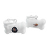 A white bone-shaped pet waste bag dispenser with a circular opening and a logo.