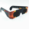 Custom solar eclipse glasses in black with a vibrant orange and yellow design, featuring a logo on the side.