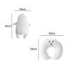A bear-shaped, white travel pillow with dimensions and a logo, featuring a cute face and soft texture.