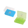 A blue and green square pill box with six compartments, featuring logos on the lids. One box is transparent.