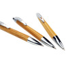 Three eco-friendly bamboo click pens with chrome accents, showcasing a natural wood finish.