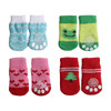 Four pairs of colourful pet socks in blue with patterns, green with a smiley face, pink with hearts, and red with a Christmas tree design.